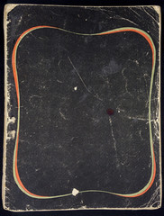 Black grunge paper sheet with decorative frame , isolated on black background.