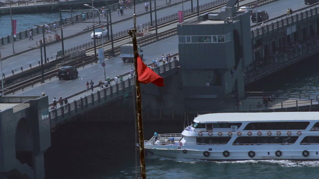 Ship goes under Galata Bridge in Istanbul, Turkey