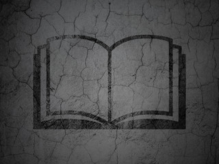 Learning concept: Book on grunge wall background