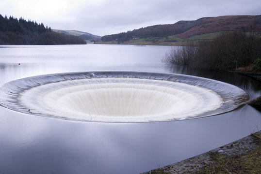 DERBYSHIRE UK - 06 Oct : Ladybower reservoir bellmouth overflow (or plug hole) and draw off tower on 16 Feb 2014 in the Peak District, UK