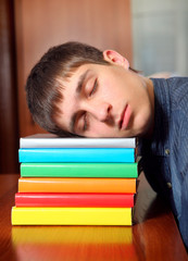 Young Man sleep on the Books