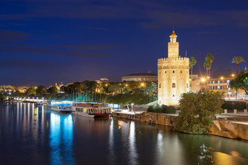 Fototapeta na wymiar Torre de Oro (Tower of Gold) at night in Seville, Andalusia