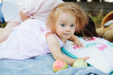 Young beautiful woman with her child outdoors