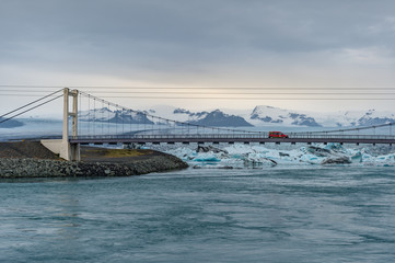 Ice cubes at  Jokulsarlon Glacier Lagoon with snow mountain range background