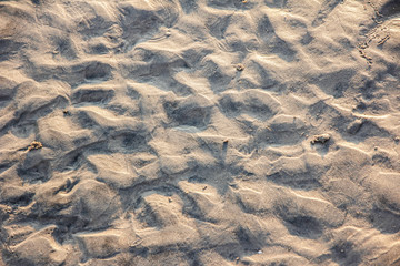 closeup of sand pattern of a beach in the summer