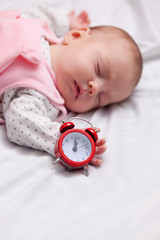 Little baby sleeping in the bed