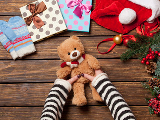 Female holding a little teddy bear