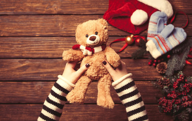 Female holding a little teddy bear