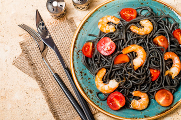 Black spaghetti with prawns and cherry tomatoes