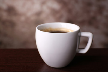 Cup of coffee on table close up