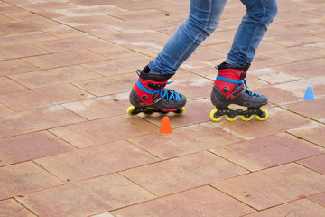 skating in-line in the street with cones