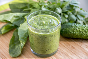 Green Smoothie. Health Food and Diet Concept. Wooden Background.