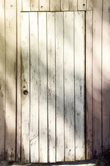 Textured door on wooden background
