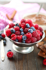 Beautiful composition with chocolate cream and ripe berries
