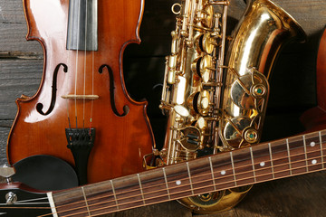 Obraz premium Close up view on musical instruments on wooden background