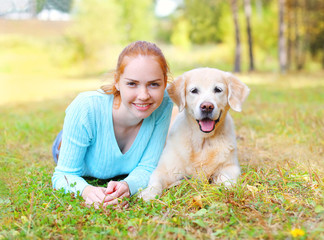 Portrait happy smiling owner woman and Golden Retriever dog lyin