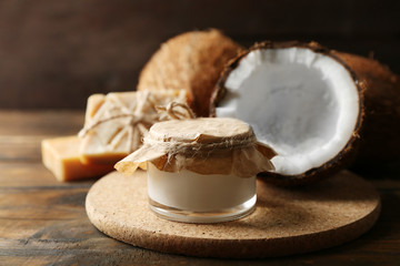 Spa coconut products on dark wooden background