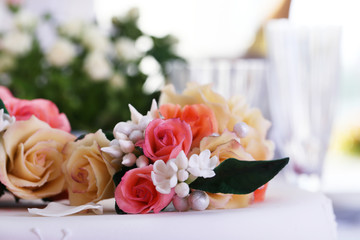 Flowers on wedding cake, close-up