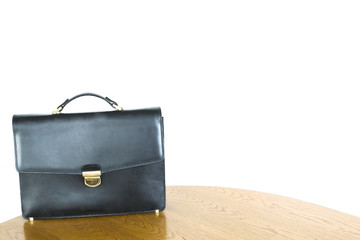 lone black briefcase on the table
