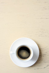 Cup of tasty coffee on table
