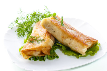 fried stuffed spring rolls on a plate