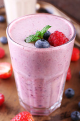 Milkshakes on wooden background, close-up
