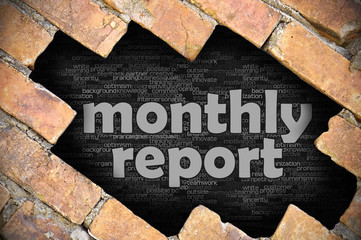 Hole in the brick wall with word monthly report