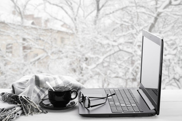 Laptop and coffee on winter window - 97672805