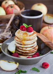 Breakfast with apple pancakes with honey
