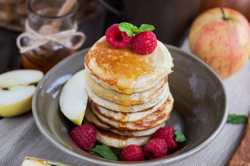 Breakfast with apple pancakes with honey
