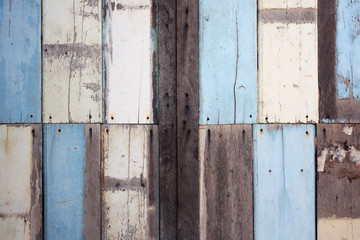 weathered wooden panel as background.