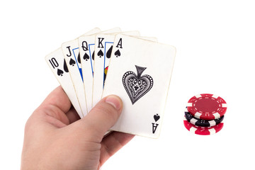 Сards and poker chips in hand