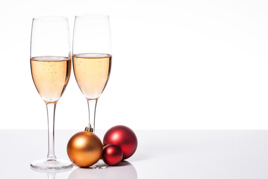 two glasses of champagne with a Christmas decoration