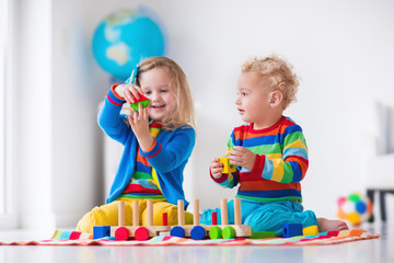 Kids playing with wooden toy train