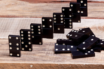 old dominoes lies on a wooden surface. background.