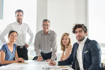 Group of office coworkers with their grey hair senior boss