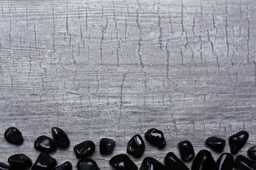 Frame of black onyx on grey scratch background, copy space