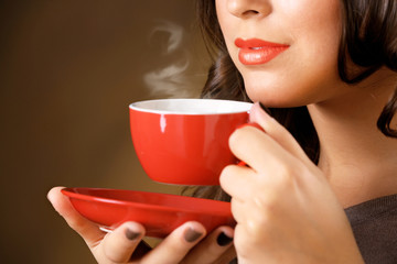Portrait of pretty woman with cup of coffee, close up