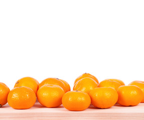 A mandarine on wooden table.