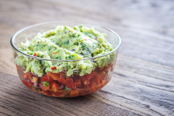 Bowl of guacamole with salsa
