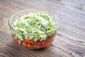Bowl of guacamole with salsa