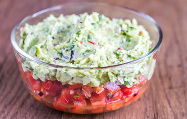 Bowl of guacamole with salsa