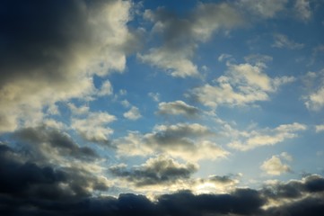 Naklejka na ściany i meble gray clouds in the blue sky