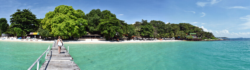 Panorama of the tropical beach resort from wooden jetty