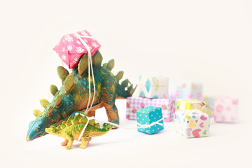 Dinosaurs carrying gift boxes.New year and Vintage background.