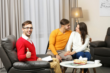 Young happy couple after therapy session with family psychologist