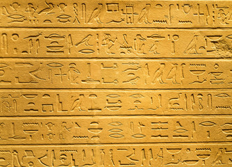 Ancient egyptian hieroglyphs carved on sandstone