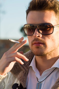 Sexy Man Smoking A Cigar