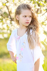 portrait of little girl outdoors in summer