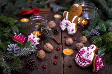 Obraz na płótnie Canvas Christmas decorations - gingerbread cookies and candles